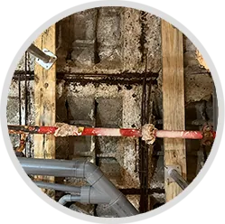 Icono de estudio y reparación de patologías constructivas en edificios.